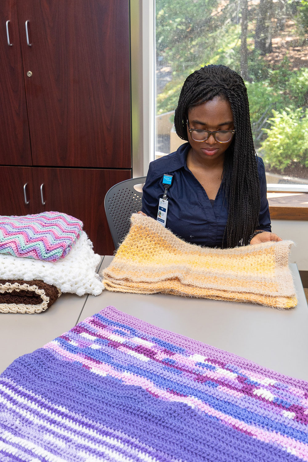 AHPL-Chaplain-folding-blankets.jpg