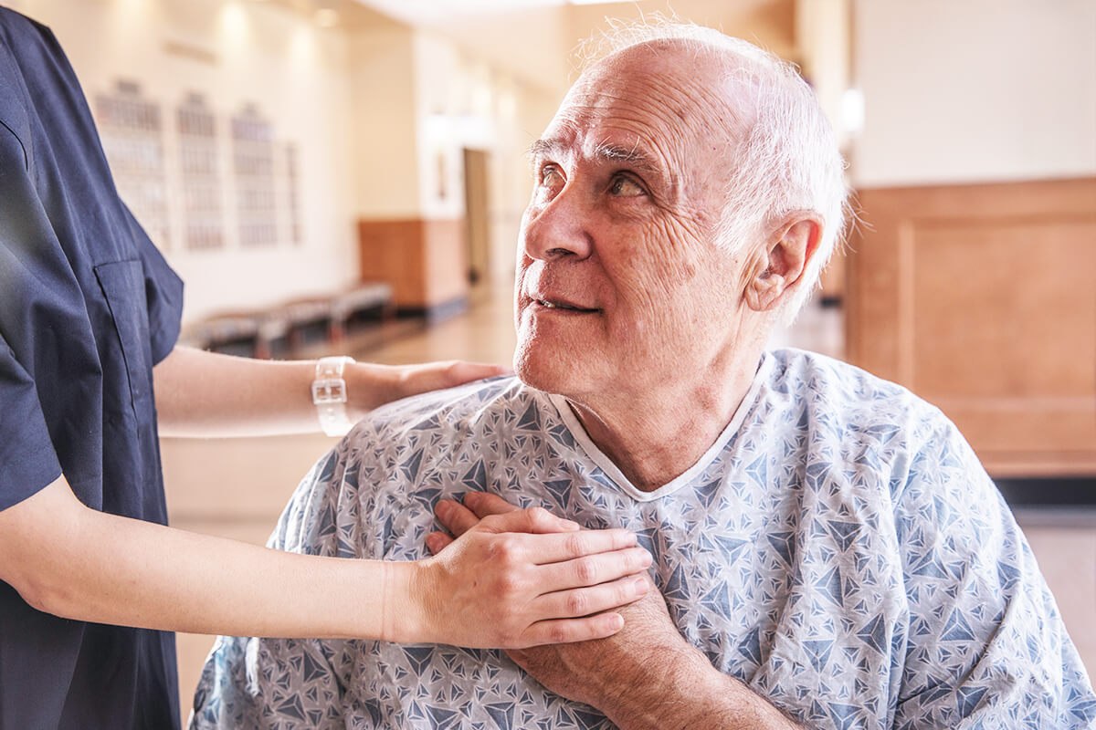 Nurse Holding Senior Patients Hand
